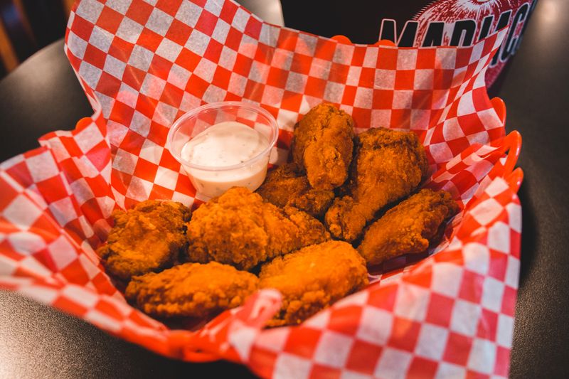 Crispy Buffalo wings tossed in spicy sauce