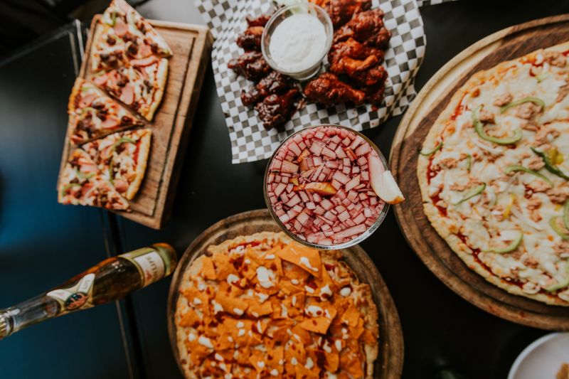 Pizza chef crafting authentic Jet's pizza pies