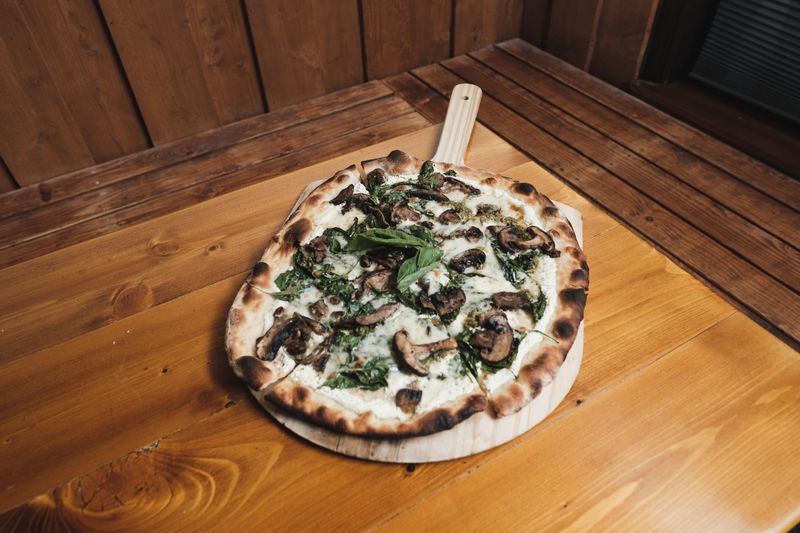 Truffle Mushroom specialty pizza with wild mushrooms and truffle oil